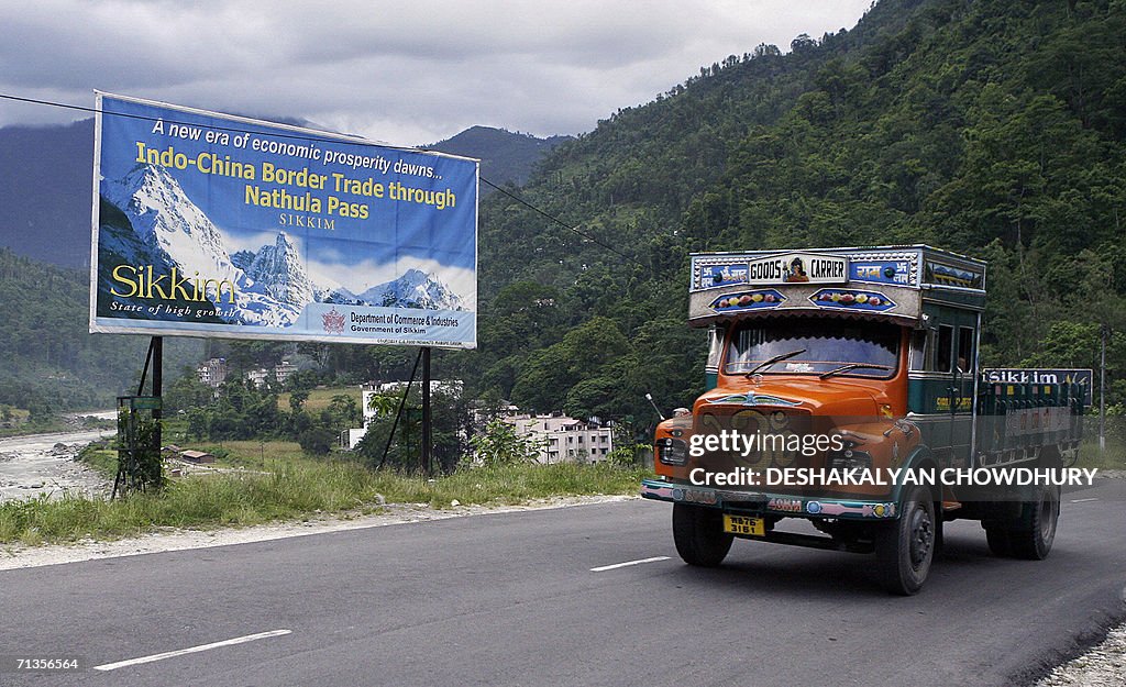A truck makes its way through the hill t