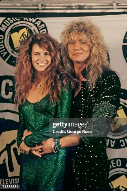 Rocker David Coverdale of the rock group "Whitesnake" poses with his girlfriend Tawny Kitaen at the 1987 MTV Music Awards at Universal City,...