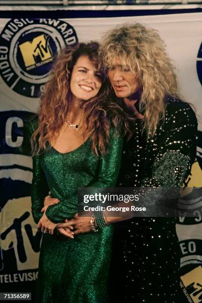 Rocker David Coverdale of the rock group "Whitesnake" poses with his girlfriend Tawny Kitaen at the 1987 MTV Music Awards at Universal City,...