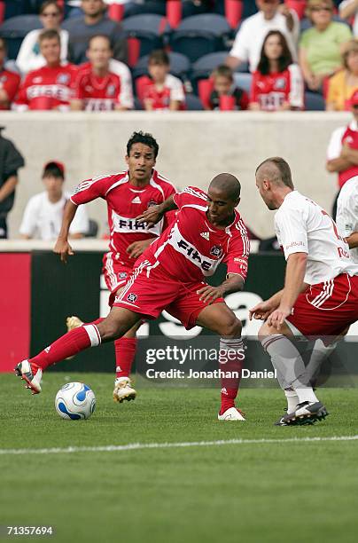 Andy Herron of the Chicago Fire controls the ball against Jeff Parke of the New York Red Bulls on June 25, 2006 at Toyota Park in Bridgeview,...