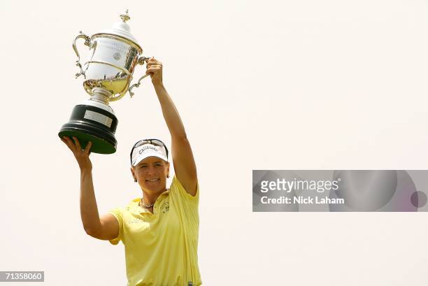Annika Sorenstam of Sweden holds the US Open Championship trophy aloft after the playoff of the 2006 U.S. Women's Open on July 3, 2006 at Newport...