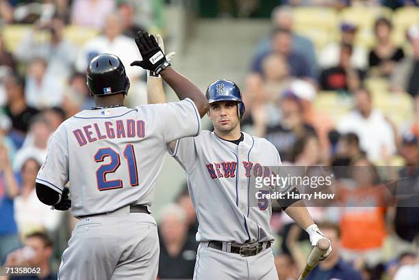 David Wright of the New York Mets high fives Carlos Delgado during game against the Los Angeles Dodgers at Dodger Stadium on June 5, 2006 in Los...