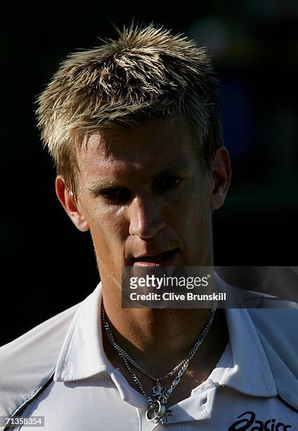 Jarkko Nieminen of Finland walks back to the baseline in his match against Dmitry Tursunov of Russia during day seven of the Wimbledon Lawn Tennis...