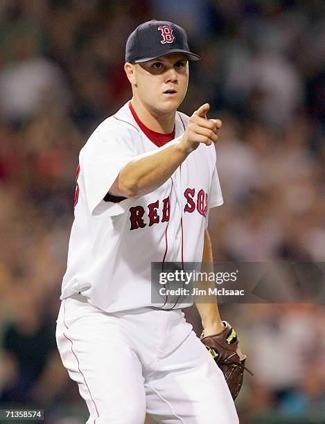 Jonathan Papelbon of the Boston Red Sox point towards first base against the New York Mets on June 29, 2006 at Fenway Park in Boston, Massachusetts.
