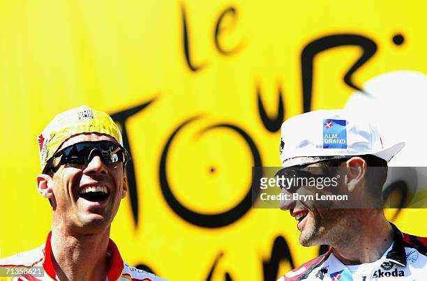 David Millar of Great Britain and Saunier Duval shares a joke with Bobby Jullich of the USA and Team CSC prior to the start of stage 2 of the 93rd...
