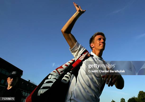 Jarkko Nieminen of Finland celebrates winning his match against Dmitry Tursunov of Russia during day seven of the Wimbledon Lawn Tennis Championships...