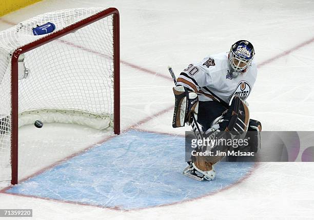 Goaltender Jussi Markkanen of the Edmonton Oilers makes a pad save against the Carolina Hurricanes during game five of the 2006 NHL Stanley Cup...