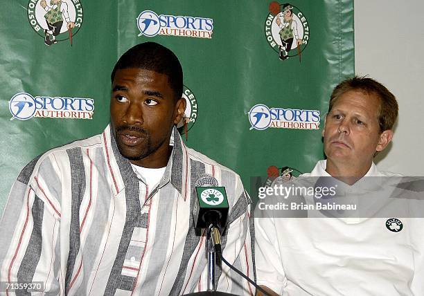 Leon Powe of the Boston Celtics speaks as Danny Ainge looks on during a press conference on July 3, 2006 at the Celtics practice facility in Waltham,...