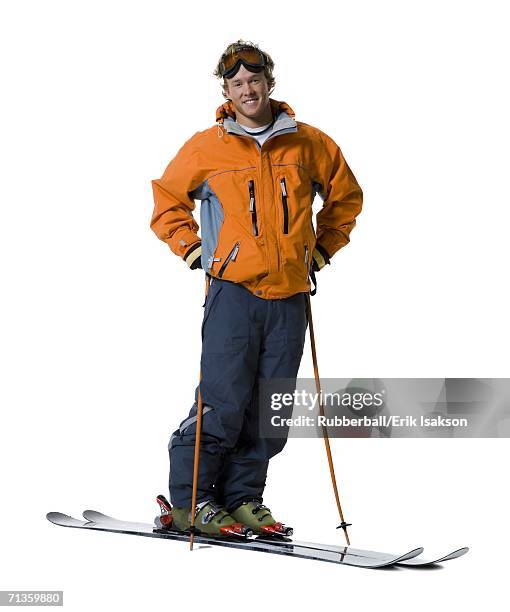 portrait of a young man skiing - skischoen stockfoto's en -beelden