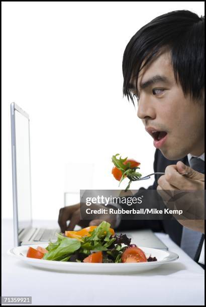 Eating A Computer Man Eating In Front Of Computer Photos and Premium High Res Pictures ...