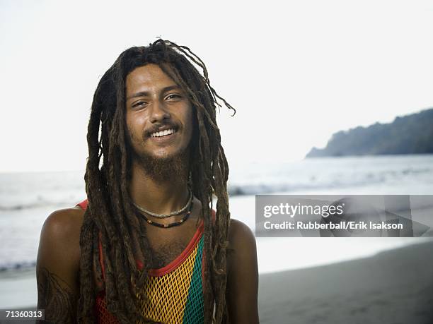 portrait of a young man smiling - rastafarian stock pictures, royalty-free photos & images