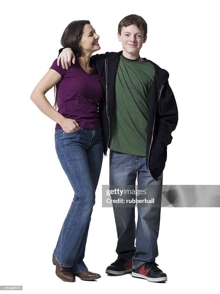 A woman standing with her son