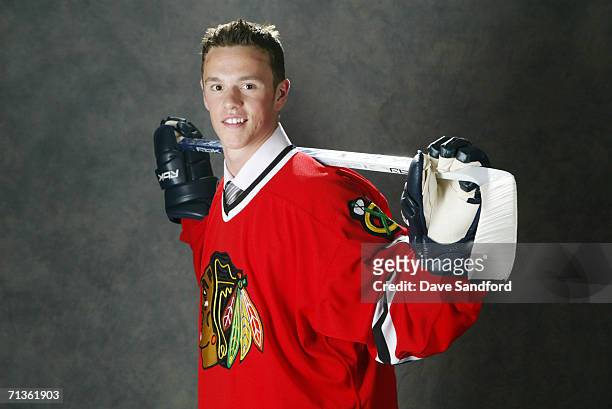 3rd overall pick Jonathan Toews of the Chicago Blackhawks poses for a photo at the 2006 NHL Draft held at General Motors Place on June 24, 2006 in...