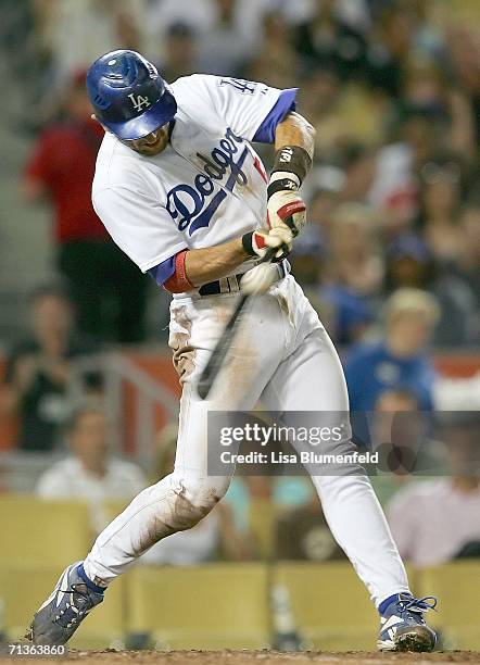 Nomar Garciaparra of the Los Angeles Dodgers hits a RBI single in the fifth inning against the Arizona Diamondbacks on July 3, 2006 at Dodger Stadium...