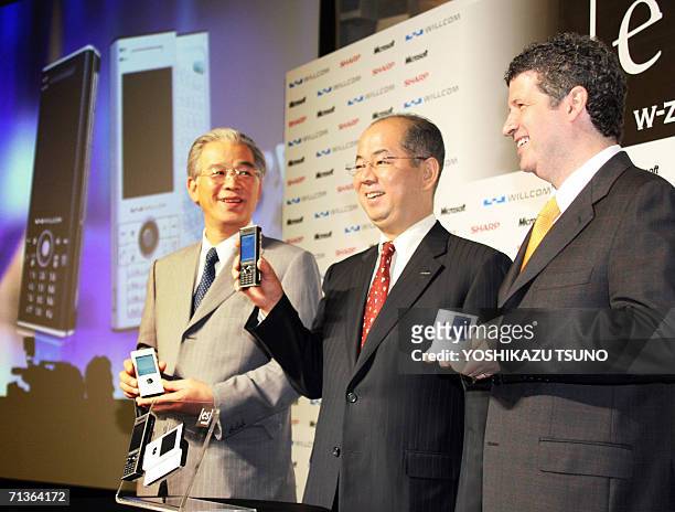 Japan's mobile communication operator Willcom President Yoichiro Yatsurugi , Japanese electronics giant Sharp Vice President Masafumi Matsumoto and...