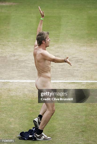 Streaker poses on centre court during the match between Maria Sharapova of Russia and Elena Dementieva of Russia on day eight of the Wimbledon Lawn...