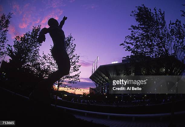 General view at sunset of the Arthur Ashe Statue and Stadium during the US Open at the USTA National Tennis Center in Flushing Meadows, New...