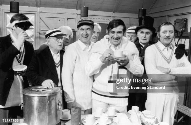 English cricketer Fred Trueman with members of the cast of the British TV sitcom 'Dad's Army', November 1970. Left to right: Ian Lavender, Arthur...