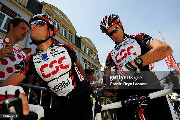 Christian Vandevelde of the USA and Team CSC and team mate Stuart O'Grady of Australia sign autographs prior to stage 3 of the 93rd Tour de France...