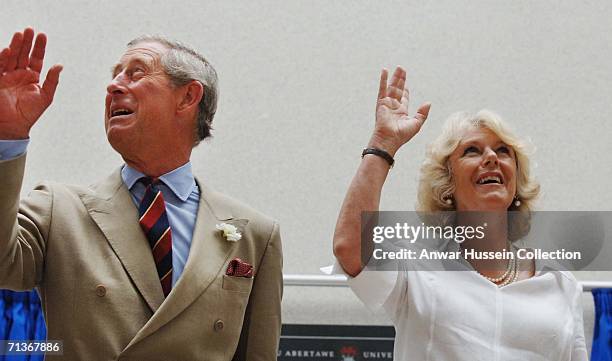 Prince Charles, Prince of Wales and Camilla, Duchess of Cornwall wave during their visit to the University of Wales, Swansea on July 4, 2006 in...