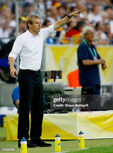 Germany Manager Juergen Klinsmann gestures during the FIFA World Cup Germany 2006 Semi-final match between Germany and Italy played at the Stadium...