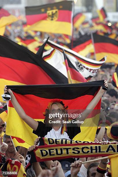 Germany soccer fans wave German national flags prior to watching the FIFA World Cup 2006 Semi Finals match between Germany and Italy at the Fan Fest...