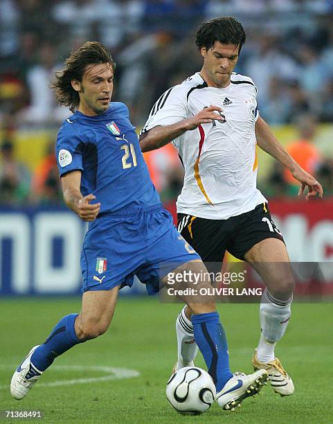 Italian midfielder Andrea Pirlo fights for the ball with German midfielder Michael Ballack during the semi-final World Cup football match between...