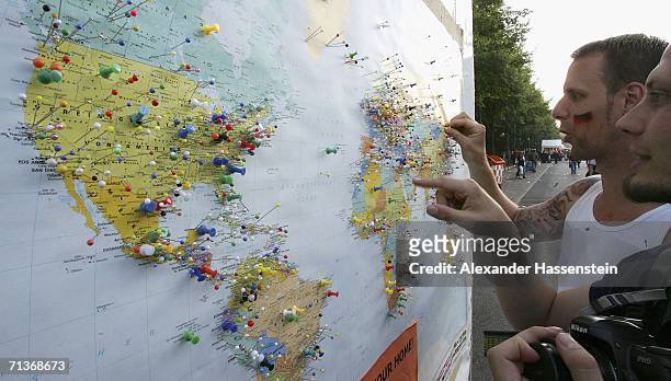 Football fans look at a pin board showing a map of the world, with pins for Football fans home towns during the FIFA World Cup 2006 Semi Final match...