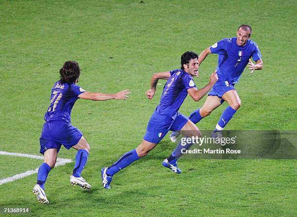 Fabio Grosso of Italy celebrates scoring his team's first goal in extra time during the FIFA World Cup Germany 2006 Semi-final match between Germany...