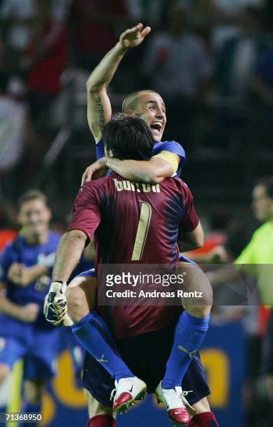 Gianluigi Buffon and Fabio Cannavaro of Italy celebrate Fabio Grosso's goal in extra time during the FIFA World Cup Germany 2006 Semi-final match...