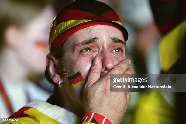 German Team supporter cries after watching the FIFA World Cup 2006 Semi Final match between Germany and Italy at the Fan Fest outdoor viewing area at...