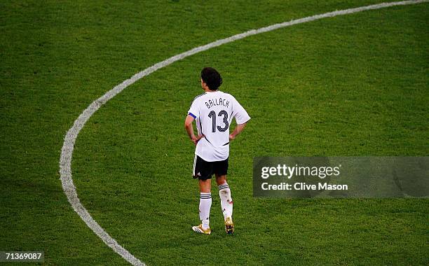 Michael Ballack of Germany shows his dejection following his team's defeat at the end of the FIFA World Cup Germany 2006 Semi-final match between...