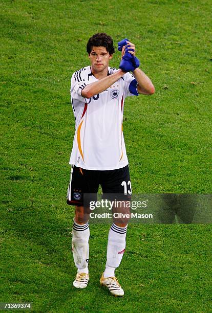 Michael Ballack of Germany dejectedly applauds the fans following his team's defeat at the end of the FIFA World Cup Germany 2006 Semi-final match...
