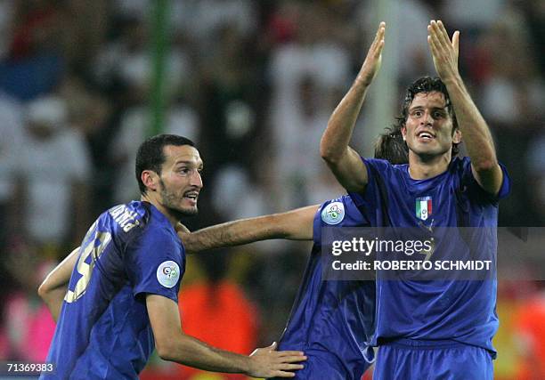 Italian defender Fabio Grosso celebrates his goal in extra time with Italian defender Gianluca Zambrotta during the semi-final World Cup football...