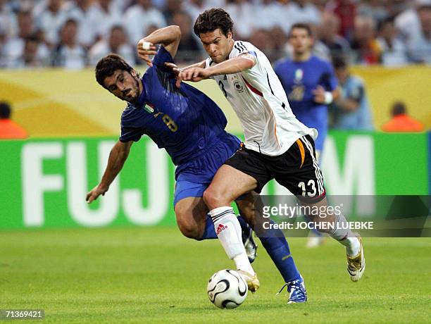 German midfielder Michael Ballack fights for the ball with Italian midfielder Gennaro Gattuso during the 2006 Football World Cup semi-final match...