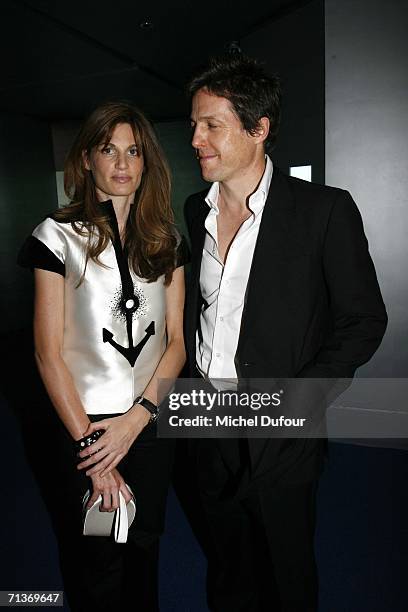 Jemima Khan and Hugh Grant attend a retrospective of the work of Cristobal Balenciaga at the Museum of Fashion and Textiles July 4, 2006 in Paris,...