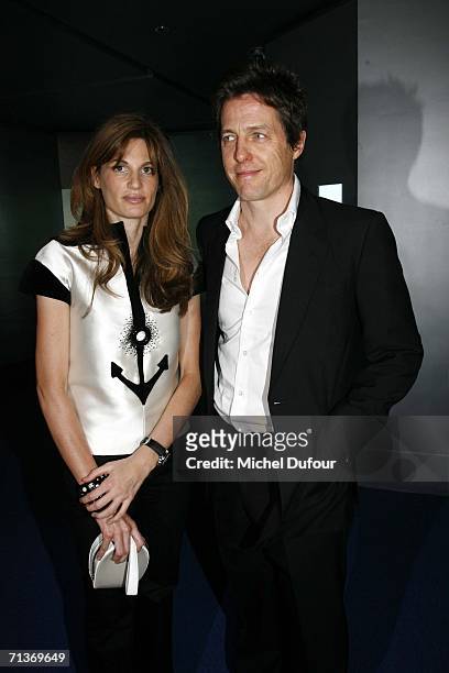 Jemima Khan and Hugh Grant attend a retrospective of the work of Cristobal Balenciaga at the Museum of Fashion and Textiles July 4, 2006 in Paris,...