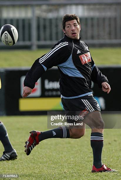 Halfback Byron Kelleher passes the ball during an All Blacks training session at Rugby Park on July 05, 2006 in Christchurch, New Zealand. The All...