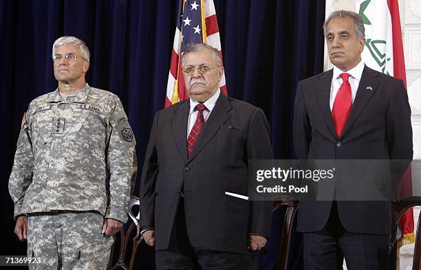 Iraqi President Jalal Talabani is flanked by U.S. Ambassador to Iraq Zalmay Khalilzad , and U.S. Forces commander in Iraq General George Casey as...