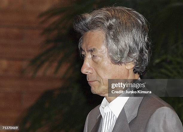 Japanese Prime Minister Junichiro Koizumi leaves the Prime Minister's Official Residence on July 5, 2006 in Tokyo, Japan. North Korea test-fired six...