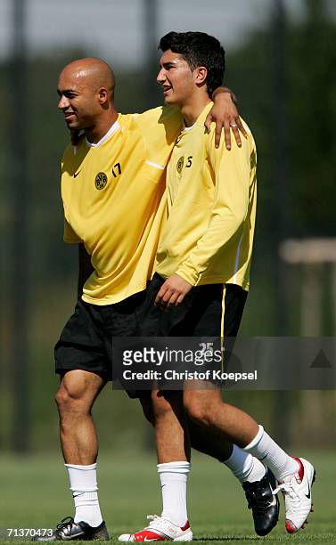 Dede embraces Nuri Sahin during the Borussia Dortmund training session at the Training Ground on July 3, 2006 in Dortmund, Germany.