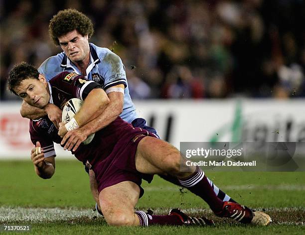 Josh Hannay of Queensland is tackled by Matt King of New South Wales during game three of the ARL State of Origin series between the New South Wales...