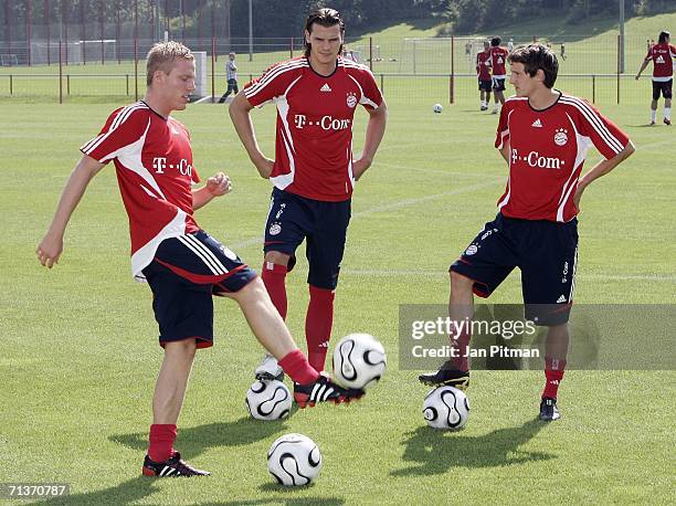 The new players of FC Bayern Munich Daniel Van Buyten, Stephan Fuerstner and Christian Lell are seen during the first training session of the season...