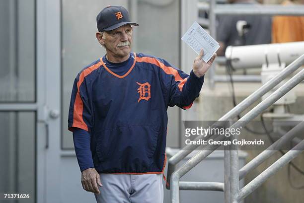 Manager Jim Leyland of the Detroit Tigers holds the lineup card while standing in the dugout before the start of a game against the Pittsburgh...