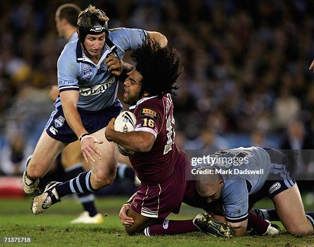 Steve Menzies and Mark O'Meley of New South Wales tackles Sam Thaiday of Queensland during game three of the ARL State of Origin series between the...