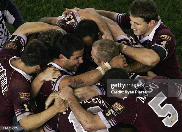 The Maroons celebrate after game three of the ARL State of Origin series between the New South Wales Blues and the Queensland Maroons at the Telstra...