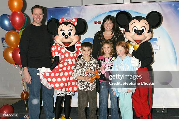 Swimming legend Kieren Perkins and his family with Mickey and Minnie Mouse attend the Magical World of Disney On Ice opening night at the Sydney...