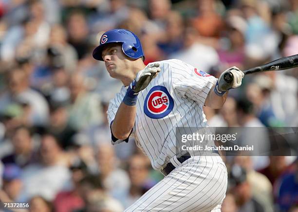 Michael Barrett of the Chicago Cubs swings at the pitch during the game against the Chicago White Sox on June 30, 2006 at Wrigley Field in Chicago,...