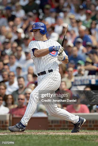 Michael Barrett of the Chicago Cubs swings at the pitch during the game against the Chicago White Sox on June 30, 2006 at Wrigley Field in Chicago,...