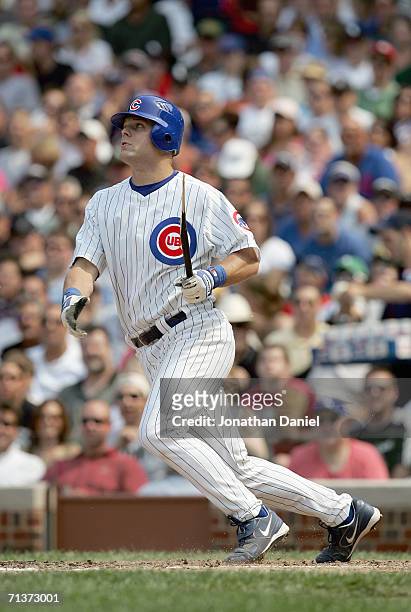 Michael Barrett of the Chicago Cubs makes a hit during the game against the Chicago White Sox on June 30, 2006 at Wrigley Field in Chicago, Illinois.